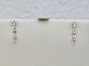 14 K White Gold Dangle Diamond Earrings 0.27 Carats.
